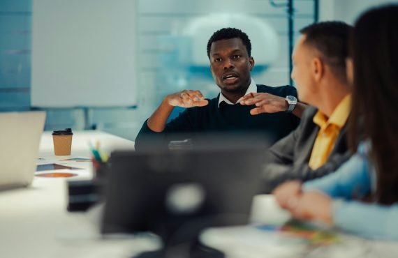 portrait-of-an-african-american-man-talking-during-a-meeting-in-a-modern-office